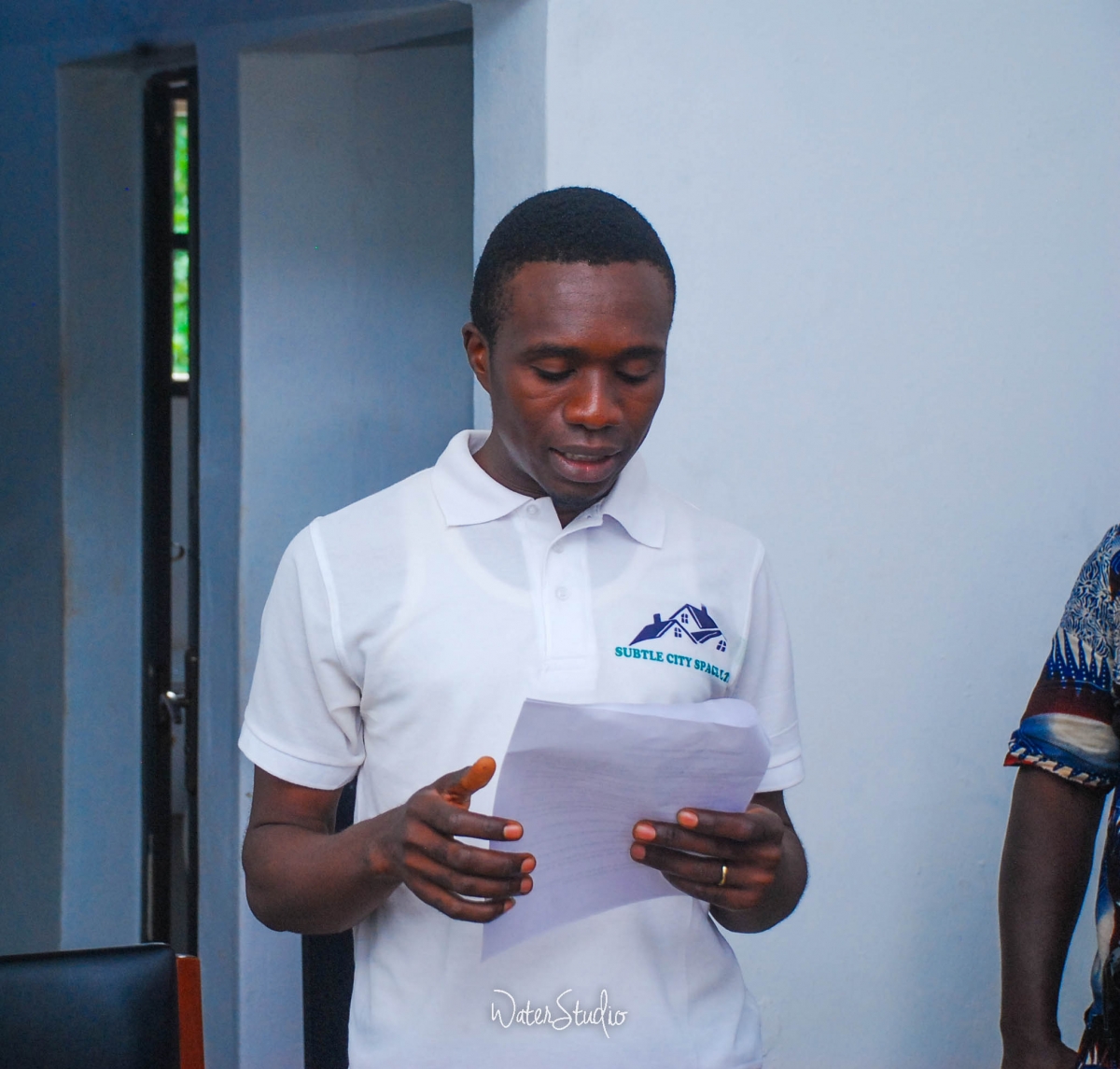 Elder Engr Okwuosa's citation being read by one of the youths he mentored who is now a successful photographer